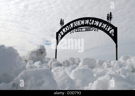 Entrance gate to the Flora Cemetery blocked by snow, Northeast Oregon. Stock Photo