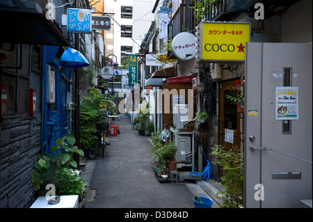 Narrow backstreet alley of bygone-era bars, pubs and eateries from 1950's in the Golden-Gai neighborhood of East Shinjuku, Tokyo Stock Photo