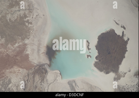 A Crew Earth Observation image from the ISS shows Salar de Coipasa in Bolivia, including Lake Poopo and the Lauca River, captured during a flight over the Andes Altiplano, providing geographical, environmental, and scientific data. Stock Photo