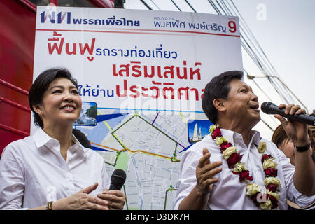 Feb. 17, 2013 - Bangkok, Thailand - Thai Prime Minister YINGLUCK SHINAWATRA and PONGSAPAT PONGCHAREON campaign for governor of Bangkok in Bangkok Sunday. Pol General Pongsapat Pongcharoen, a former deputy national police chief who also served as secretary-general of the Narcotics Control Board is the Pheu Thai Party candidate in the upcoming Bangkok governor's election. (He resigned from the police force to run for Governor.) Former Prime Minister Thaksin Shinawatra reportedly recruited Pongsapat. Most of Thailand's reputable polls have reported that Pongsapat is leading in the race and likely Stock Photo