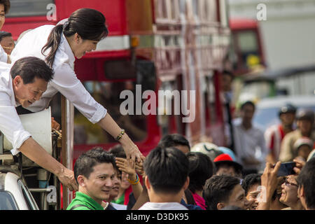 Feb. 17, 2013 - Bangkok, Thailand - Pheu Thai gubernatorial candidate PONGSAPAT PONGCHAREON and Thai Prime Minister YINGLUCK SHINAWATRA campaign for Pongsapat in Bangkok Sunday. Pol General Pongsapat Pongcharoen, a former deputy national police chief who also served as secretary-general of the Narcotics Control Board is the Pheu Thai Party candidate in the upcoming Bangkok governor's election. (He resigned from the police force to run for Governor.) Former Prime Minister Thaksin Shinawatra reportedly recruited Pongsapat. Most of Thailand's reputable polls have reported that Pongsapat is leadin Stock Photo