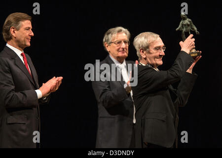 Former Soviet officer Stanislav Petrov holds the 'Dresden Prize' in front of ZDF journalist and laudatory speaker Claus Kleber (L) and FDP politician Gerhart Baum in the Semper Opera in Dresden, Germany, 17 February 2013. The prize is worth 25,000 euros. The alarm was signalled while he was on duty at the command center for the Soviet Air Defence Forces on 26 September 1983. The 73 year-old judged the alarm to be a false alarm preventing a nuclear attack on the USA. Photo: OLIVER KILLIG Stock Photo
