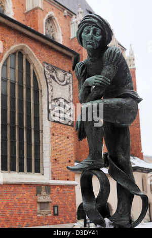 Statue of a medieval man by St Mary's Basilica in Kraków, Poland. Stock Photo