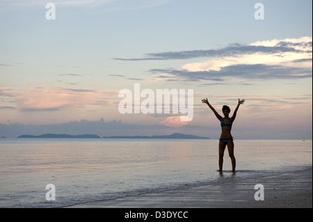 Phi Phi Iceland, Thailand, a woman in a bikini enjoying the evening at the beach Stock Photo