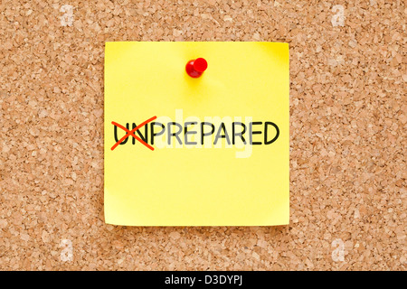 Turning the word Unprepared into Prepared with red marker on yellow sticky note pinned with red push pin. Stock Photo