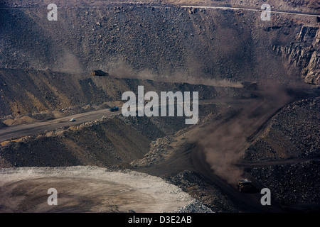 AN TAI BAO, SHANXI PROVINCE, CHINA - AUGUST 2007: 150 ton trucks bring coal up to ground level from the base of the An Tai Bao, the world's largest open cast mine. Stock Photo