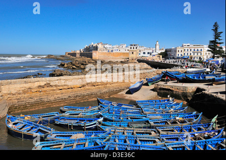 From the Genoese-built citadel looking over the fishing boats towards the ramparts of the C16 th Portuguese fort of Essaouira Stock Photo