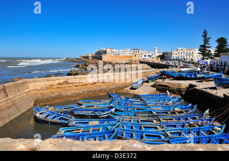 From the Genoese-built citadel looking over the fishing boats towards the ramparts of the C16 th Portuguese fort of Essaouira, Morocco Stock Photo