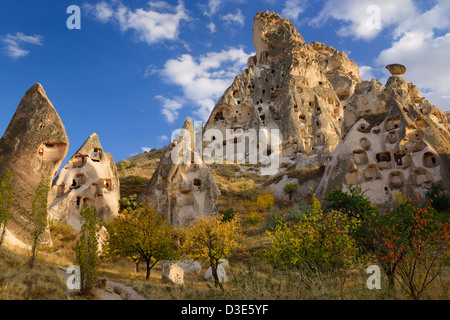 Fairy chimneys and ancient Uchisar Castle carved out of volcanic tuff Cappadocia Turkey Stock Photo