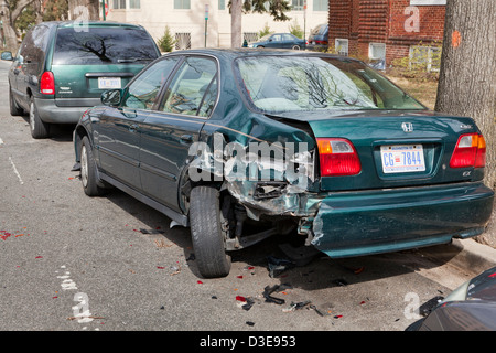 Car with rear quarter panel damage in hit and run accident - USA