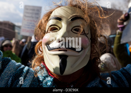 Closeup of someone wearing a Guy Fawkes mask Stock Photo