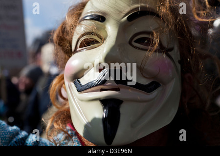 Closeup of someone wearing a Guy Fawkes mask Stock Photo