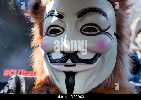 Closeup of someone wearing a Guy Fawkes mask Stock Photo