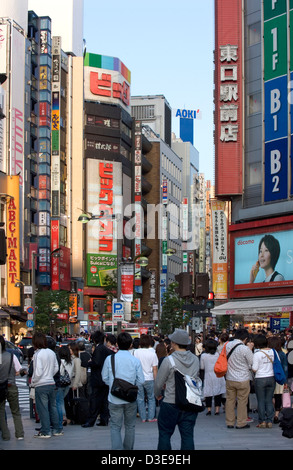 Shoppers crowd the streets of the East Shinjuku shopping and entertainment district in downtown Tokyo. Stock Photo