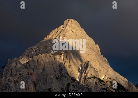 Peak Ehrwalder Sonnenspitze in the eerie light of an approaching thunderstorm, Ehrwald, Tyrol, Austria Stock Photo