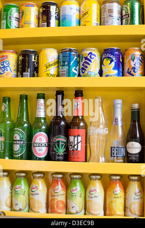 Soft drink Cans and Beer on a shelf Stock Photo