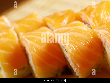 Philadelphia classic. Salmon, Philadelphia cheese, cucumber, avocado, tobiko. Japanese sushi Stock Photo