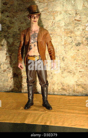 Models posing with ray guns and steampunk or dieselpunk aesthetic costumes in the first Retrofuturistic Week in Barcelona. Stock Photo