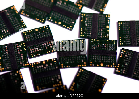 Close view of a bunch of computer memory chips isolated on a white background. Stock Photo