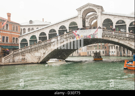 A view of the Rialto bridge while a heavy snowfall in Venice, Italy. Stock Photo