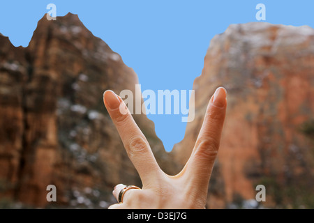 Female hand on a background the Zion national park in Utah on winter Stock Photo