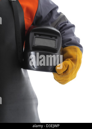 Body shot of welder wearing protective welding leather apron and glove holding welding hood over white Stock Photo