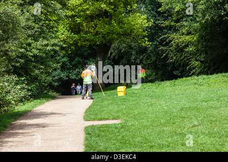 Surveyors with theodolite amongst the visitors on Box Hill, Surrey, UK Stock Photo