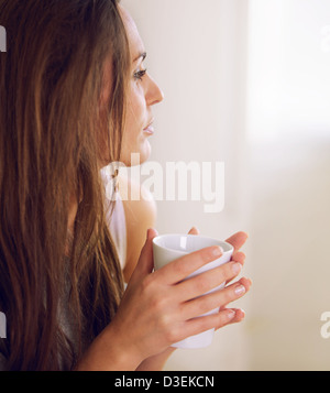 Closeup of an attractive woman eating a healthy breakfast Stock Photo