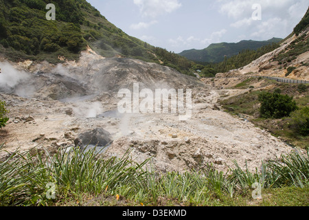 Sulphur gases and steam rise from the volcano at Soufriere in St Lucia, West Indies. Stock Photo