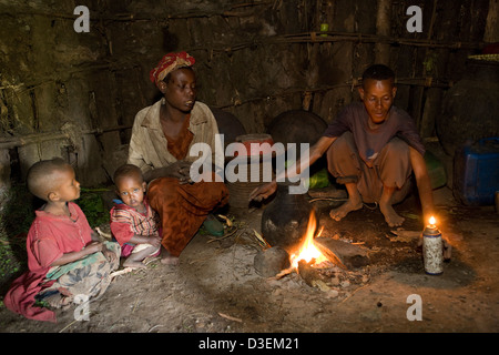 DUGANO KOSHAMBO VILLAGE, SOUTHERN ETHIOPIA, 20TH AUGUST 2008: Worknesh Teme and her husband and children inside their house Stock Photo