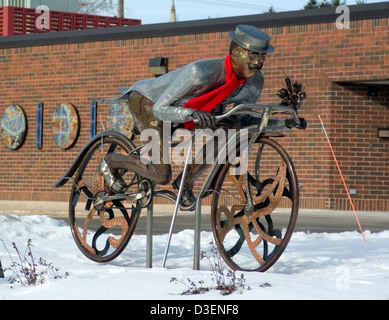 'Late for a Date' bicyclist metal sculpture at Rahr-West Museum Manitowoc Wisconsin Stock Photo