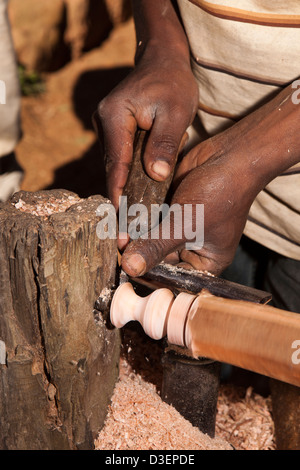 Madagascar, Ambositra, hands of craftsman turning wood on human-powered lathe Stock Photo