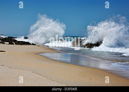 Waves breaking onto rocks, Western Australia Stock Photo