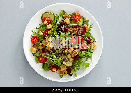 Beetroot cucumber tomato sweetcorn walnut salad Stock Photo