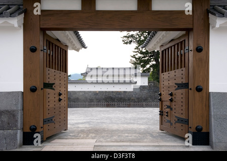 Guard tower through an open gate at Odawara Castle, former stronghold of Doi Clan during Kamakura Period in Kanagawa Prefecture Stock Photo