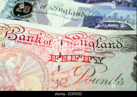 Close up photo of a British fifty pound bank note on top of a twenty pound note. Stock Photo
