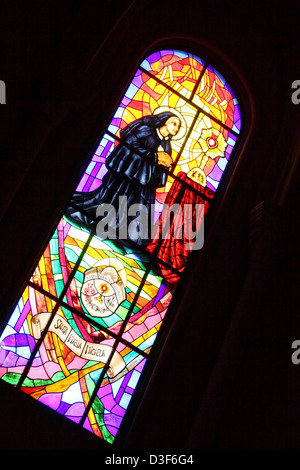 Madrid Spain stained glass window in the cathedral Catedral de Nuestra Senora de la Almudena - cathedral was built in 20th C Stock Photo