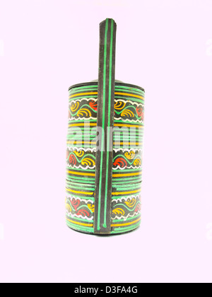 A colorful tradiA colorful traditional tiffin carrier from Bagan, Burma isolated on white background, Handmade from Bagan, Burma Stock Photo