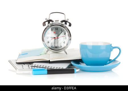 Blue coffee cup, alarm clock and office supplies. Isolated on white background Stock Photo
