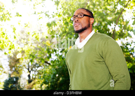 Portrait of a young man in green sweater Stock Photo