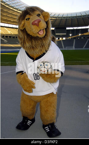 (dpa) - The official mascot of the 2006 FIFA Soccer World Cup, a lion named Goleo, holds the speaking ball named 'Pille' at Olympic Stadium in Berlin, Germany, 16 December 2004. A television crew is in the process of shooting a trailer for German television station ZDF at the designated site of the 2006 World Cup final. Stock Photo