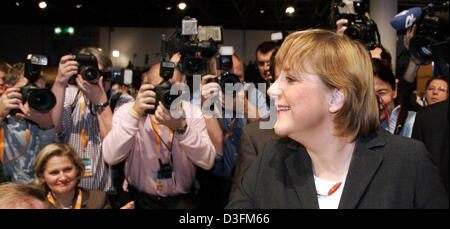 (dpa) - Angela Merkel, Leader of the German Christian Democratic Union (CDU), smiles while being photographed during the CDU's 18th party congress in Duesseldorf, Germany, 6 December 2004. Stock Photo