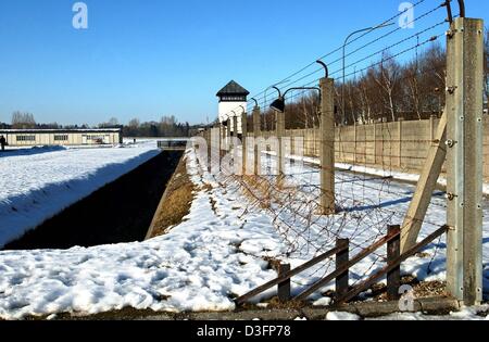 (dpa) - A view of the original fence, the watch tower and the barrack of the former Nazi concentration camp in Dachau, Germany, 25 February 2003. Dachau was the first Nazi concentration camp, established on 22 March 1933, just a few weeks after Hitler had come into power. Today Dachau is the most visited concentration camp memorial in Germany with 800,000 visitors annually. Stock Photo