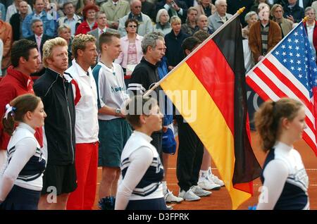 (dpa) - The former tennis stars (from L:) Michael Stich and Boris Becker from Germany, team captain Patrick Kuehnen, and John and Patrick McEnroe of the United States listen to the national anthems ahead of the Davis Cup 'revival' match in Hamburg, 8 May 2003. In the following match, which was a replay of the legendary Davis Cup match Germany against the USA 16 years ago, Becker pl Stock Photo