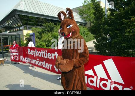 (dpa) - The animal rights group 'Animal Peace' protests at the annual general meeting of sports goods manufacturer Adidas-Salomon in front of the town hall in Fuerth, Germany, 8 May 2003. The banner reads 'Boykottiert Kaengurumoerder von Adidas' (boycott kangaroo murderers from Adidas), criticising the mass kangaroo killing caused by Adidas, because the company uses kangaroo skins  Stock Photo