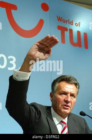 (dpa) - Michael Frenzel, Chairman of TUI AG, the tourism company, gestures with his hand during a annual balance press conference in Hanover, Germany, 7 May 2003. The earnings for 2003 in the key area of tourism are expected to lie below the niveau of the crisis ridden year of 2002. The tourism and travel industry is still having a very bad time which is in particular because of th Stock Photo