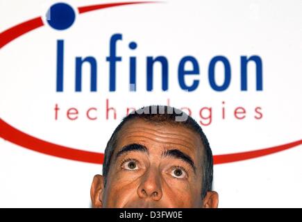 (dpa) - Ulrich Schumacher, Chairman of Germany's largest chip maker Infineon Technologies, pictured in front of the company logo in Munich, 29 April 2003. Infineon is Europe's second largest semiconductor firm. After suffering heavy losses in the two previous years the company is to cut costs and will reduce staff by another 900. Schumacher expects to save 500 million Euro. Stock Photo