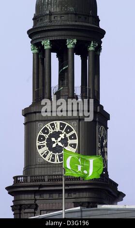 (dpa) - The flag with the logo of the printing and publishing house Gruner and Jahr AG & Co KG waves in the wind in front of a spire in Hamburg, Germany, 11 March 2003. Gruner and Jahr AG & Co KG is Europe's largest publishing house. The company owns more than 110 newspapers and is represented in 14 countries with almost 12,000 employees.  62 percent of its turnover is being earned Stock Photo