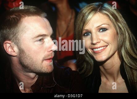(dpa) - Irish pop singer Ronan Keating and his wife Yvonne watch the Pret-a-Porter show of Cavalli in Paris, 3 March 2003. Stock Photo