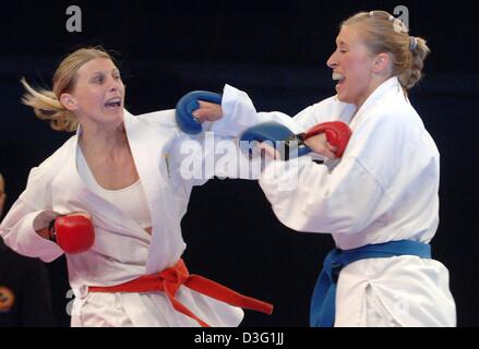 (dpa) - German Monique Puscher (R)  fights against South African Tamaryn Fry in the women's Kumite Karate competition at the 7th World Games in Duisburg, Germany, Saturday 23 July 2005. Karate is one of the 40 non-Olympic sports that are featured at the sports event, which runs from 15 July to 24 July 2005 in the Ruhr Basin towns of Duisburg, Bottrop, Oberhausen and Muelheim an der Stock Photo